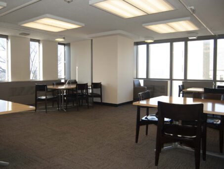 Large open space with tables and chair. Click on this picture to reserve this room.