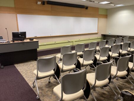 Classroom with white board and lectern. Click on this picture to reserve this room.