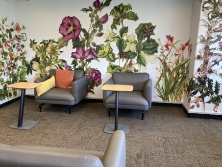 Soft seating in room with large flower mural. Click on this picture to reserve this room.