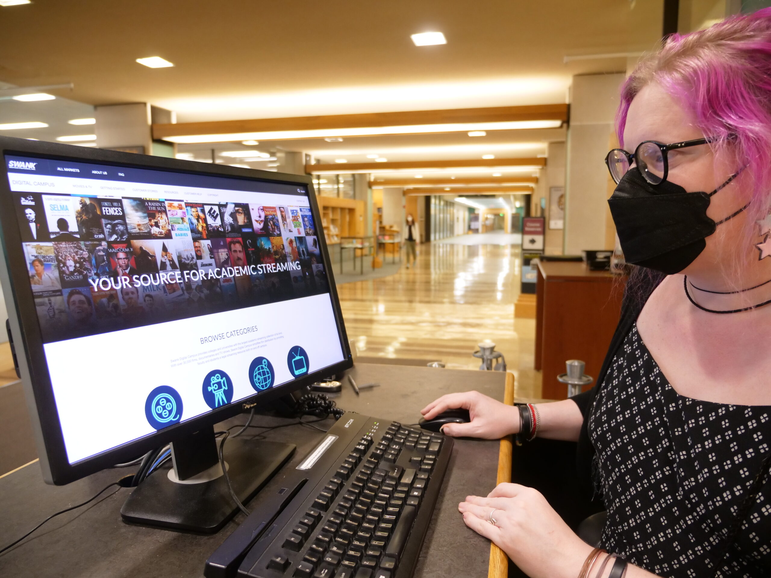 Woman viewing computer screen at Olin Library